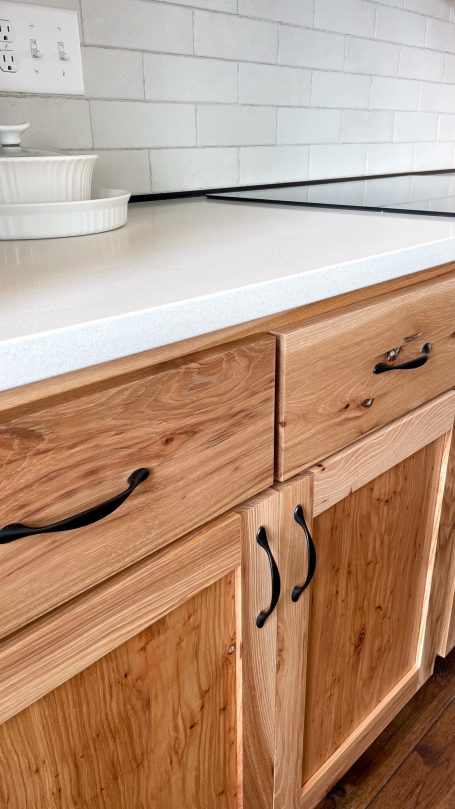 Closeup of the Hickory Cabinet handles and wood grain.
