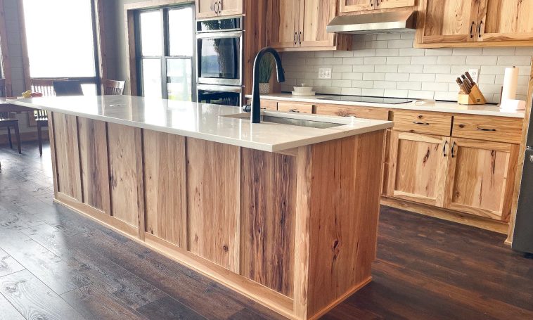 Custom island made of hickory wood with white marble countertop.