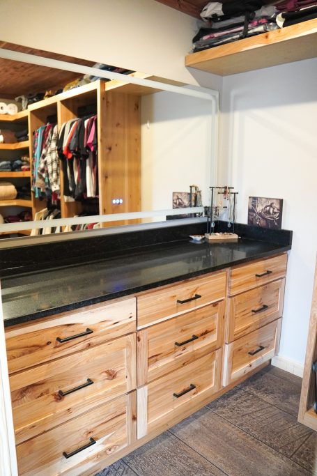 Walk-in closet with custom crafted Hickory Cabinets by the Amish